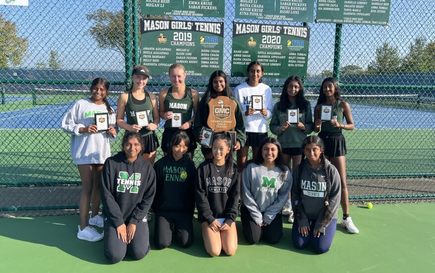 team posing with gmc champion award